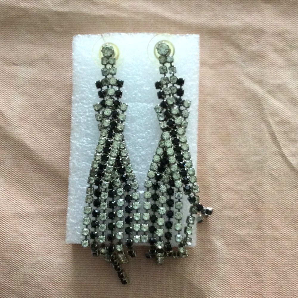 Woman’s Earrings white and black rhinestones one stone is missing as shown